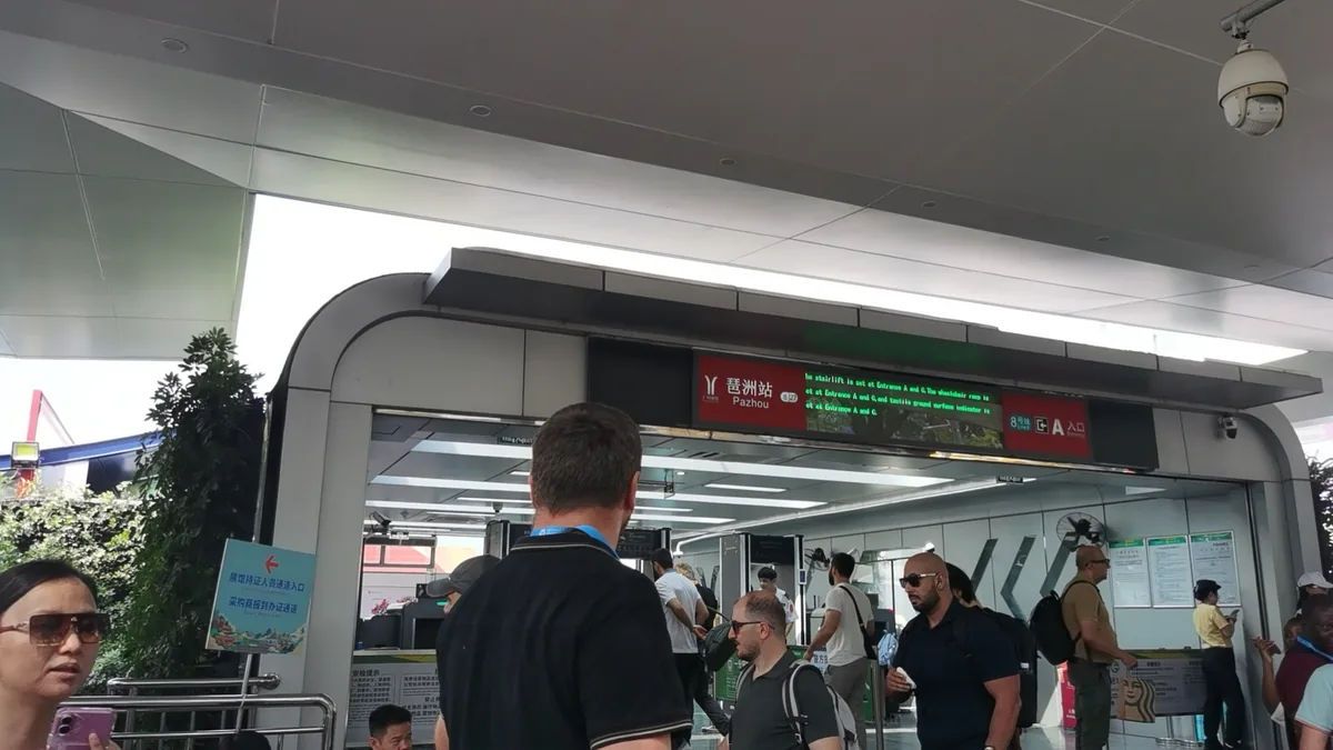 Metro exit at Pazhou station on the opening morning of the 140th Canton Fair, photographed by our team